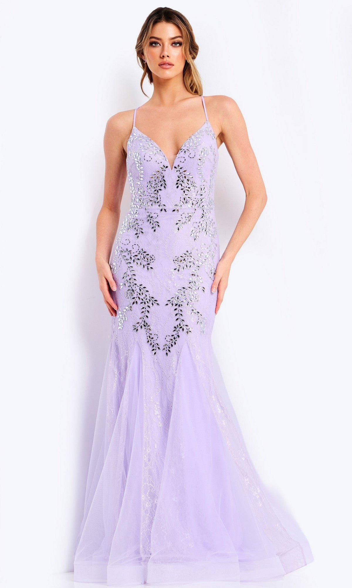 A woman poses against a plain white background wearing the Jovani 49660 Long Prom Dress in lilac/silver, a floor-length gown with thin straps, sleeveless design, and sparkling beaded embellishments.